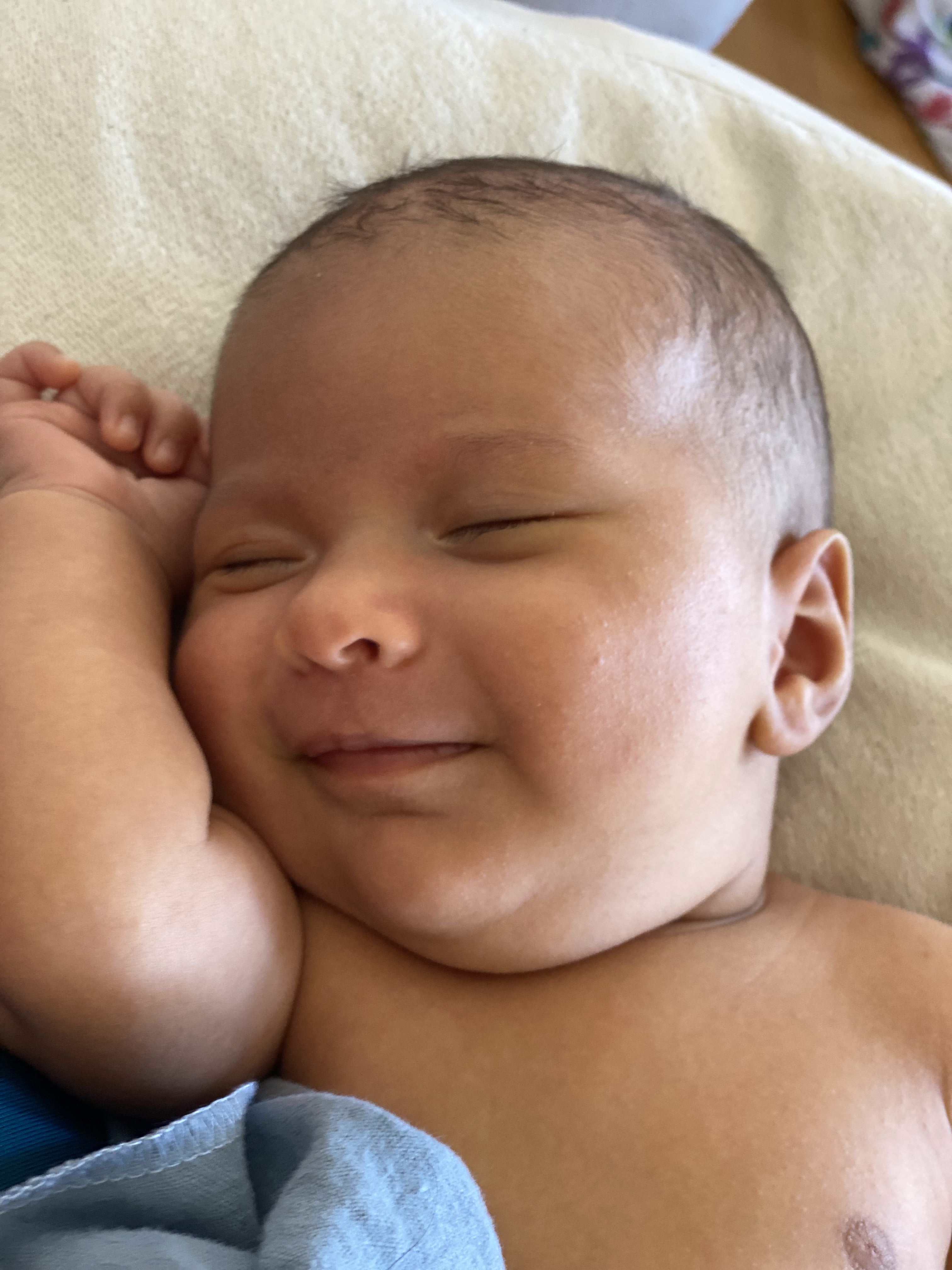 A young baby smiling